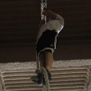 Chris Masterjohn at the top of a 20-foot rope at CrossFit South Brooklyn.